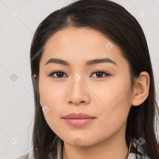 Joyful latino young-adult female with long  brown hair and brown eyes