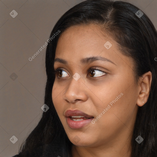 Joyful asian young-adult female with long  brown hair and brown eyes