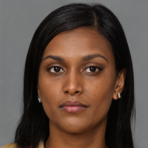 Neutral black young-adult female with long  black hair and brown eyes