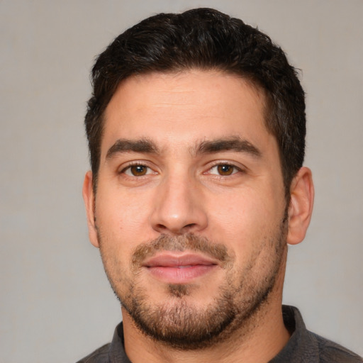 Neutral white young-adult male with short  black hair and brown eyes
