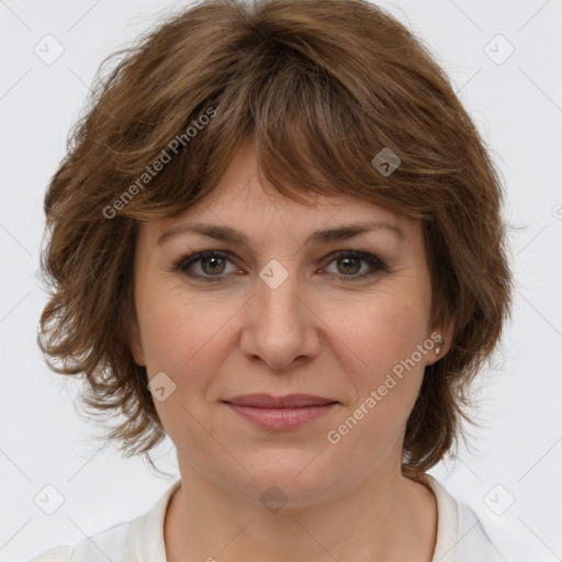 Joyful white young-adult female with medium  brown hair and green eyes