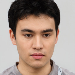 Neutral asian young-adult male with short  brown hair and brown eyes