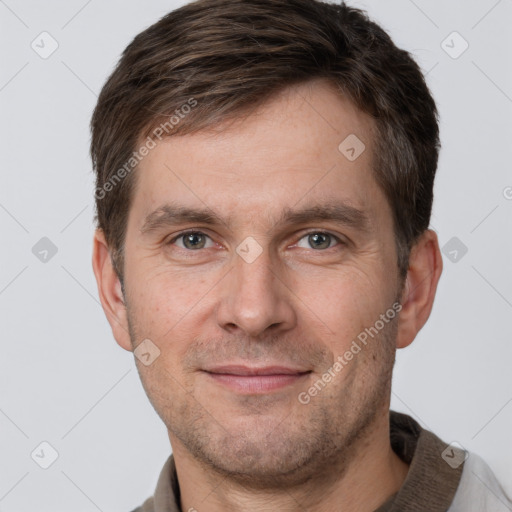 Joyful white adult male with short  brown hair and grey eyes