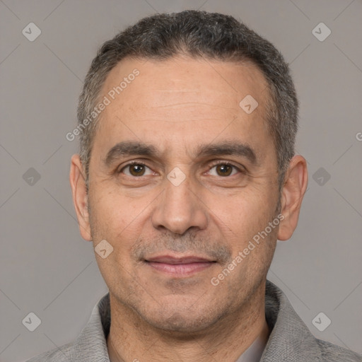 Joyful white adult male with short  black hair and brown eyes