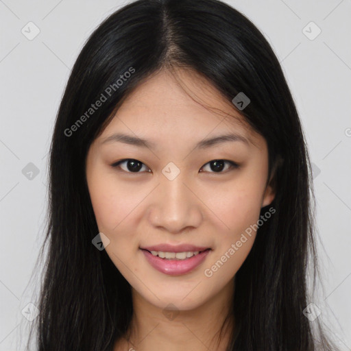 Joyful asian young-adult female with long  brown hair and brown eyes