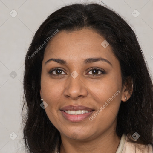 Joyful latino young-adult female with long  brown hair and brown eyes