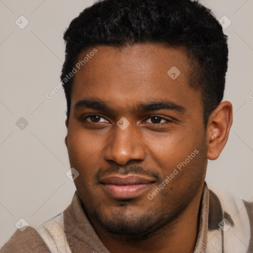 Joyful black young-adult male with short  brown hair and brown eyes