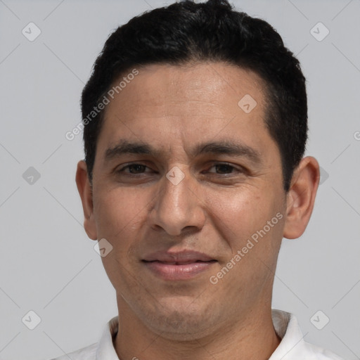 Joyful white adult male with short  black hair and brown eyes