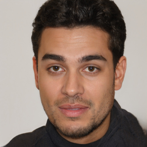 Neutral latino young-adult male with short  brown hair and brown eyes