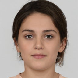 Neutral white young-adult female with medium  brown hair and brown eyes