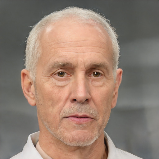 Neutral white middle-aged male with short  gray hair and brown eyes