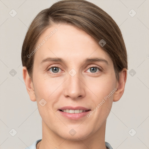 Joyful white young-adult female with short  brown hair and grey eyes