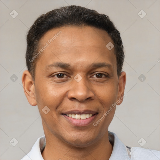 Joyful latino young-adult male with short  brown hair and brown eyes