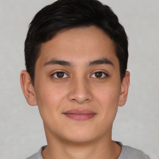 Joyful asian young-adult male with short  brown hair and brown eyes