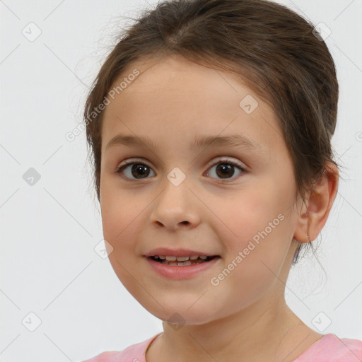 Joyful white child female with medium  brown hair and brown eyes