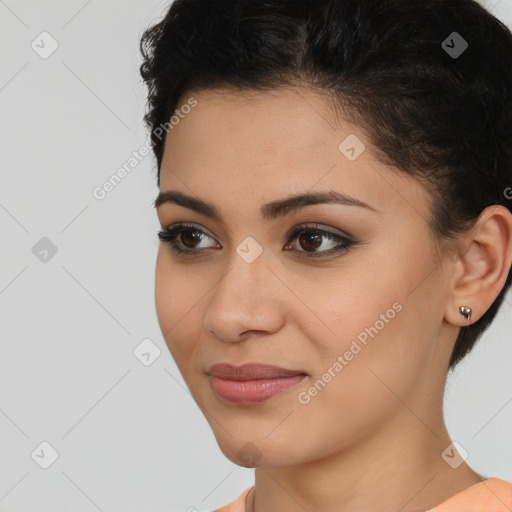 Joyful latino young-adult female with short  brown hair and brown eyes