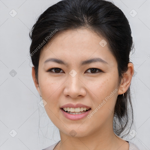 Joyful asian young-adult female with medium  brown hair and brown eyes