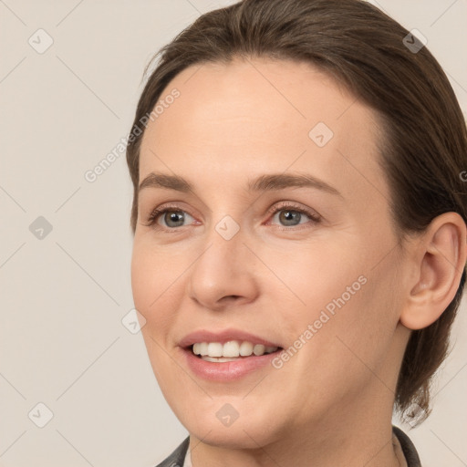 Joyful white young-adult female with medium  brown hair and brown eyes