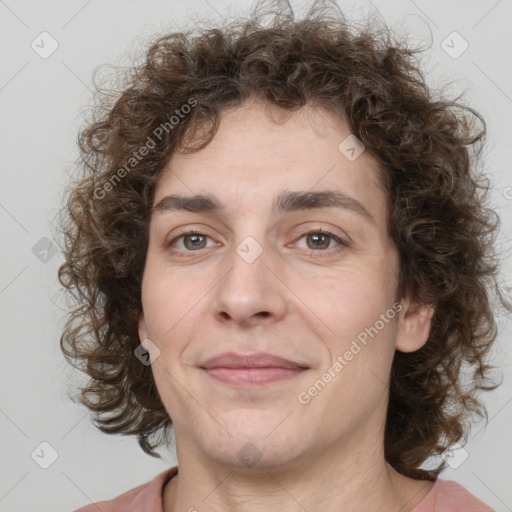 Joyful white adult male with medium  brown hair and brown eyes