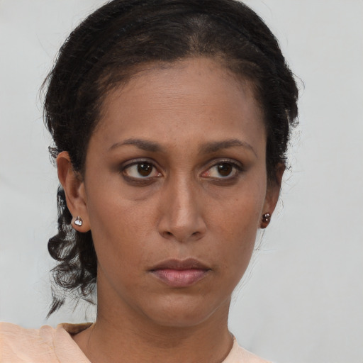 Neutral black young-adult female with short  brown hair and brown eyes