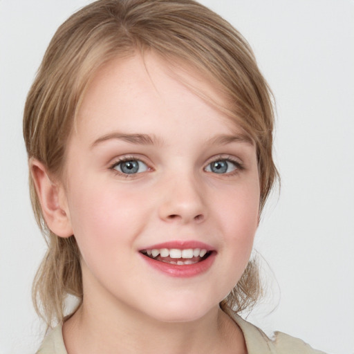 Joyful white child female with medium  brown hair and blue eyes