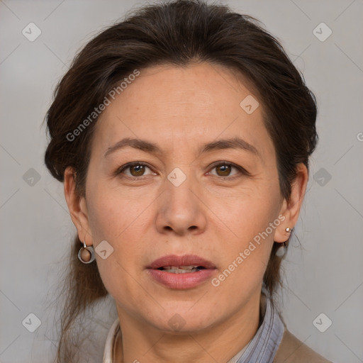 Joyful white adult female with medium  brown hair and brown eyes