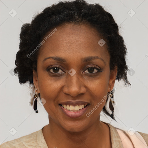 Joyful black adult female with short  brown hair and brown eyes