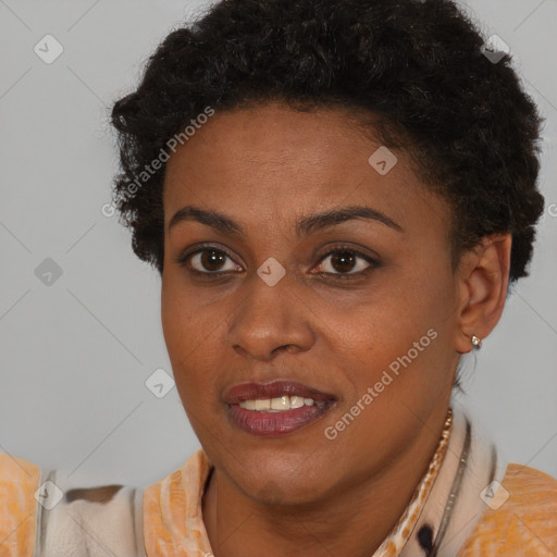 Joyful black young-adult female with short  brown hair and brown eyes