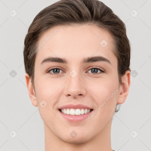 Joyful white young-adult female with short  brown hair and brown eyes