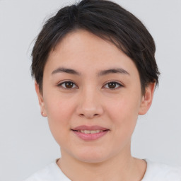 Joyful asian young-adult female with short  brown hair and brown eyes