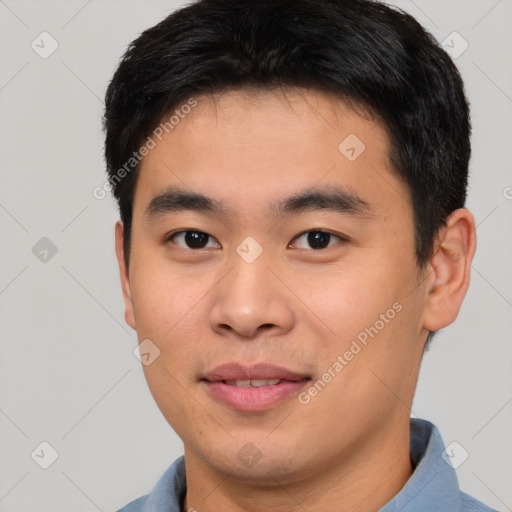 Joyful asian young-adult male with short  brown hair and brown eyes