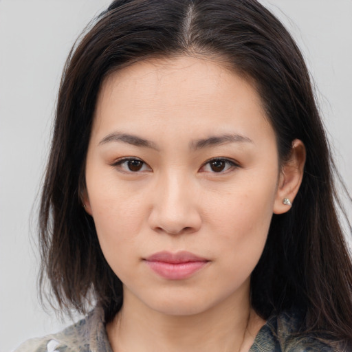 Neutral asian young-adult female with medium  brown hair and brown eyes