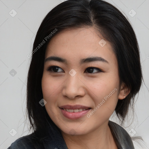 Joyful asian young-adult female with medium  black hair and brown eyes