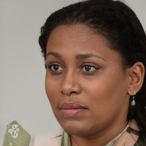 Neutral black young-adult female with short  black hair and brown eyes