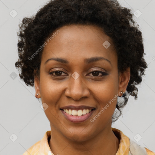 Joyful black young-adult female with short  brown hair and brown eyes