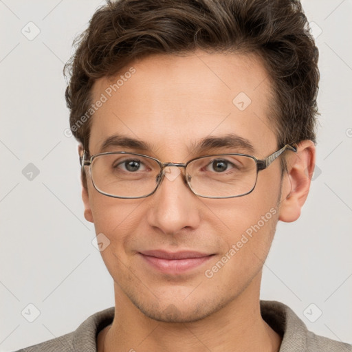 Joyful white adult male with short  brown hair and grey eyes