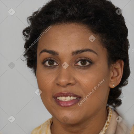 Joyful black young-adult female with long  brown hair and brown eyes