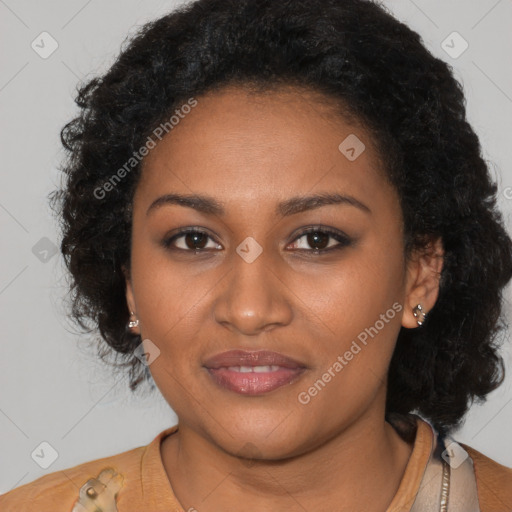 Joyful black young-adult female with long  brown hair and brown eyes