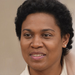 Joyful black adult female with short  brown hair and brown eyes