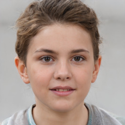 Joyful white child female with short  brown hair and brown eyes