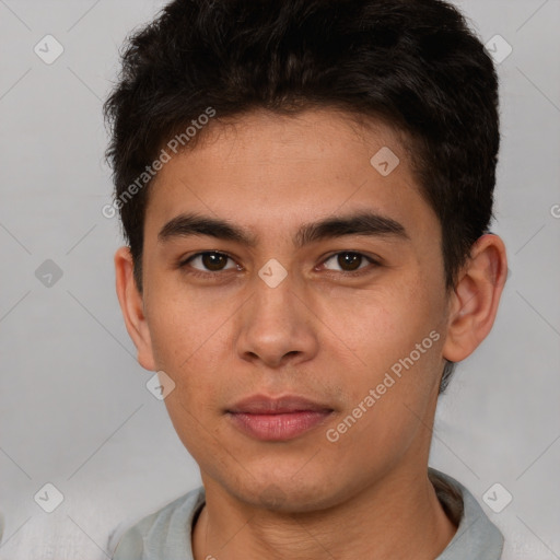 Joyful latino young-adult male with short  brown hair and brown eyes