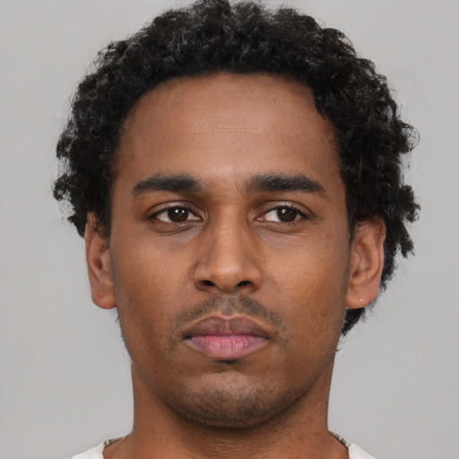 Neutral latino young-adult male with short  brown hair and brown eyes