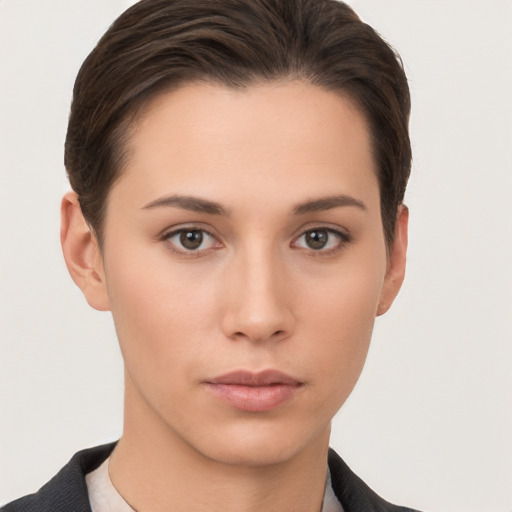 Neutral white young-adult female with short  brown hair and brown eyes