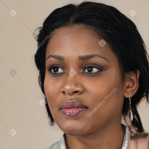 Joyful black young-adult female with medium  black hair and brown eyes