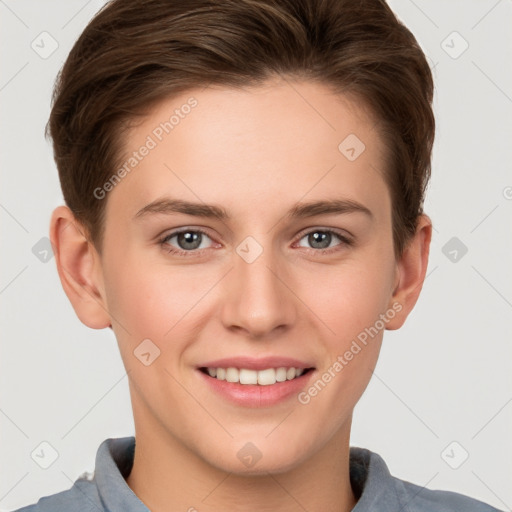 Joyful white young-adult female with short  brown hair and grey eyes