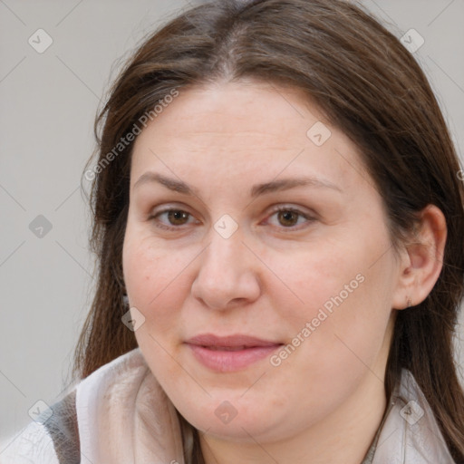 Joyful white adult female with long  brown hair and brown eyes