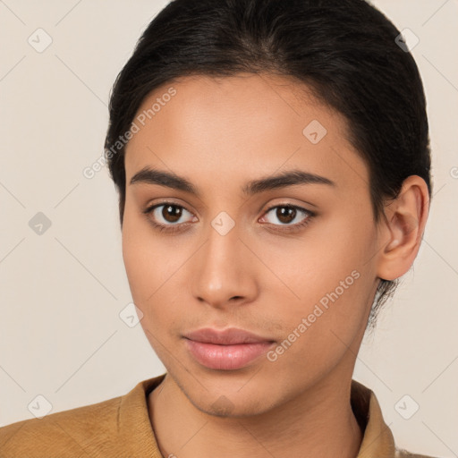 Neutral latino young-adult female with short  brown hair and brown eyes