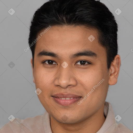 Joyful latino young-adult male with short  brown hair and brown eyes