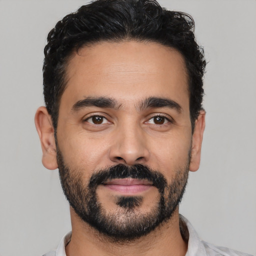 Neutral latino young-adult male with short  black hair and brown eyes