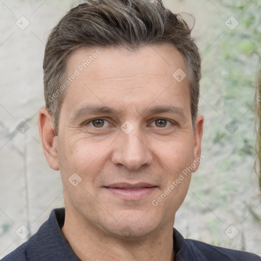 Joyful white adult male with short  brown hair and grey eyes